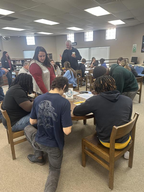Students working at a table in the library