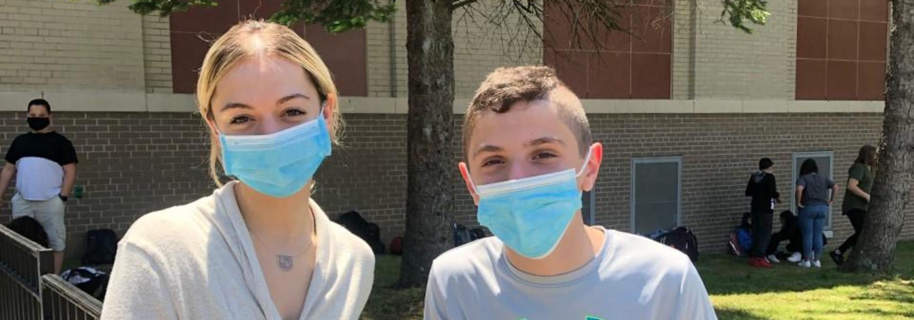Miss Kawolski and Student outside of IS 7