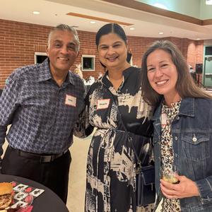Three parents standing together