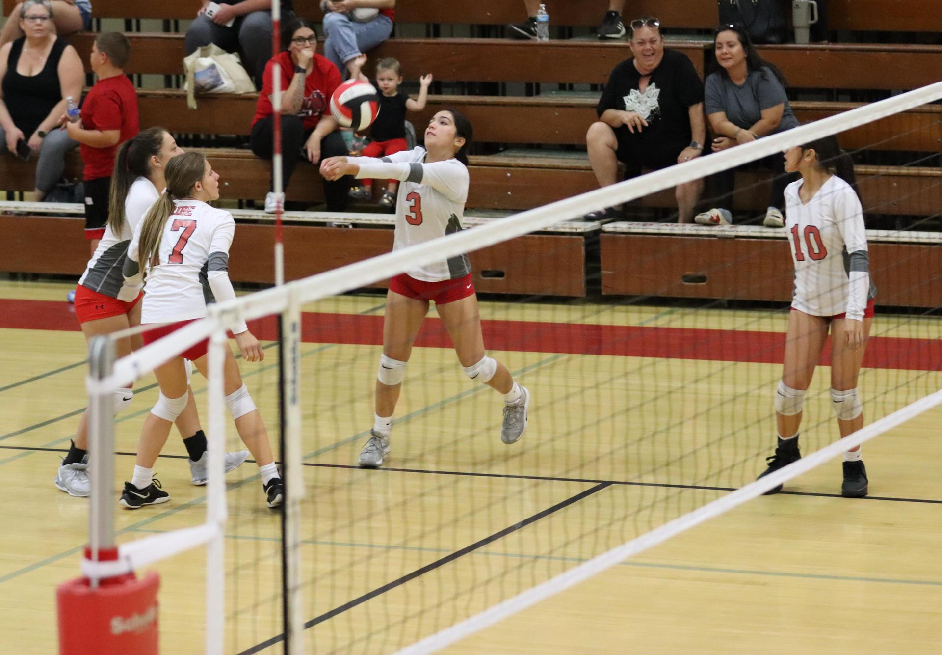 junior varsity girls playing volleyball against Liberty