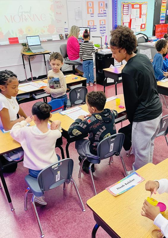 BHS Student sitting with Davis students