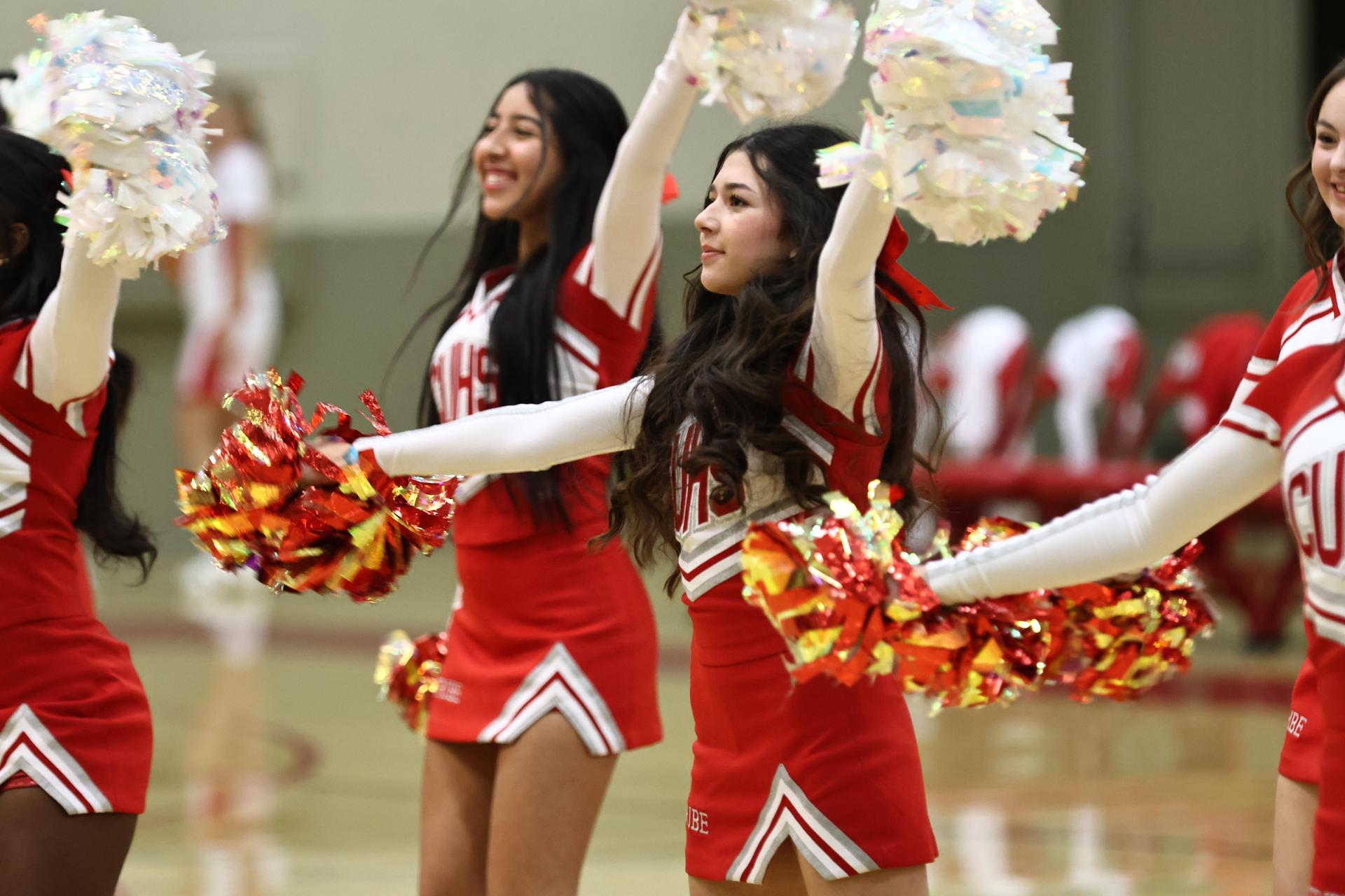 Varsity boys playing basketball against yosemite
