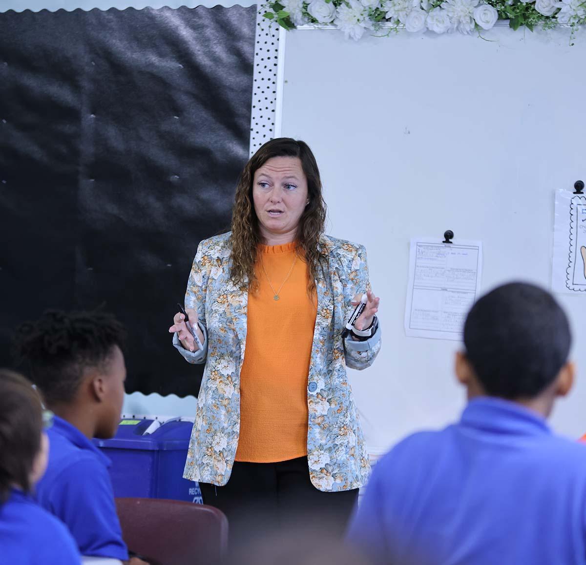 Horizon Science Academy Youngstown Teacher and student interacting at a classroom desk