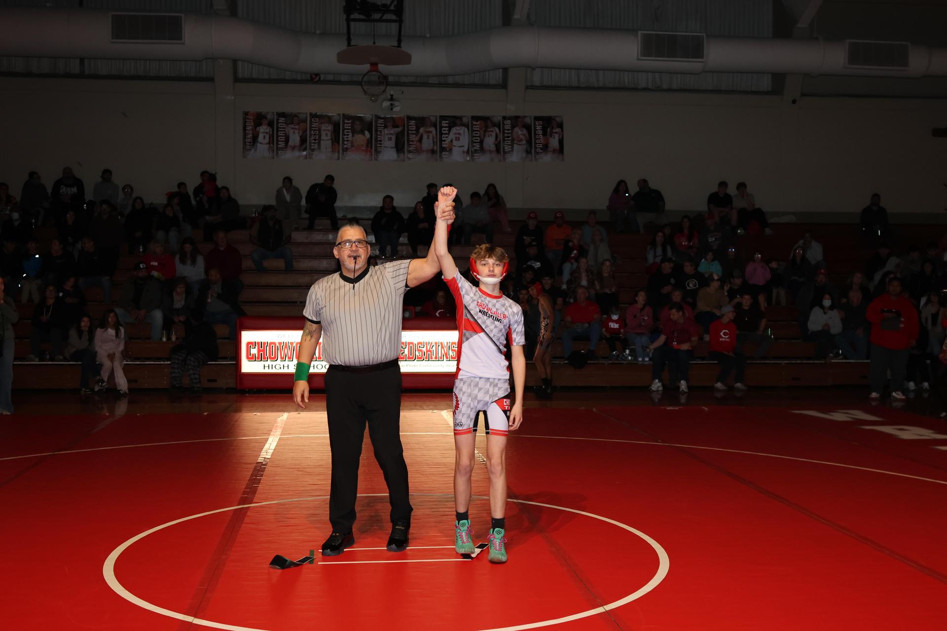 Wrestling winners with hands up 16