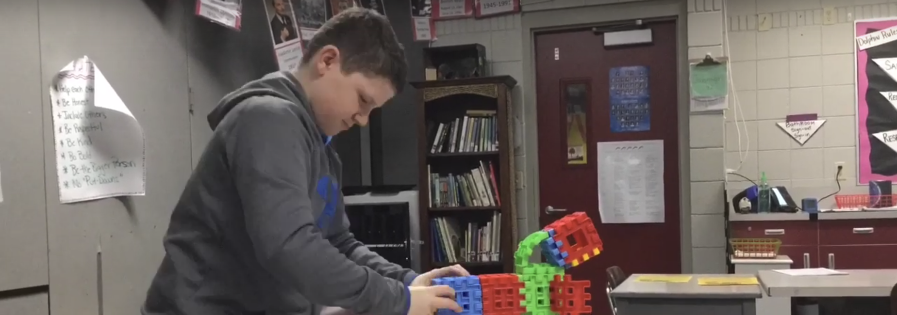Picture of student with science projecte
