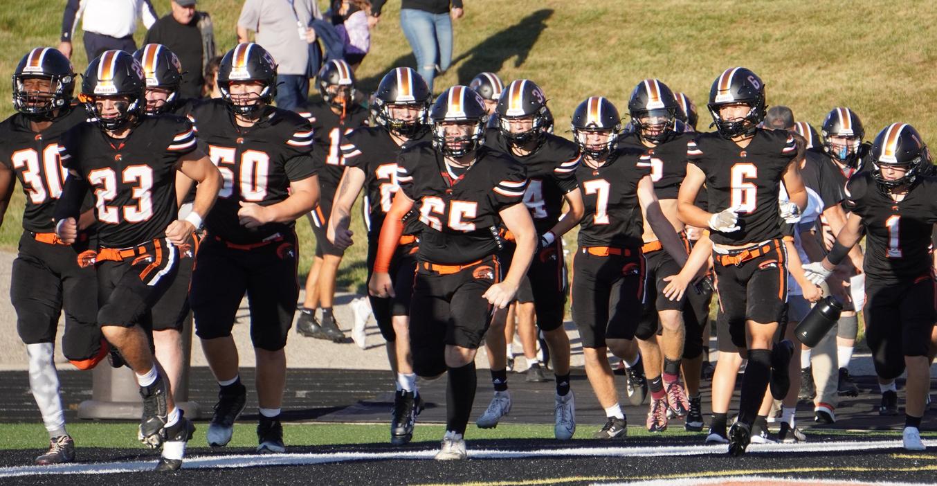 TKHS Trojan varsity football team takes the field.