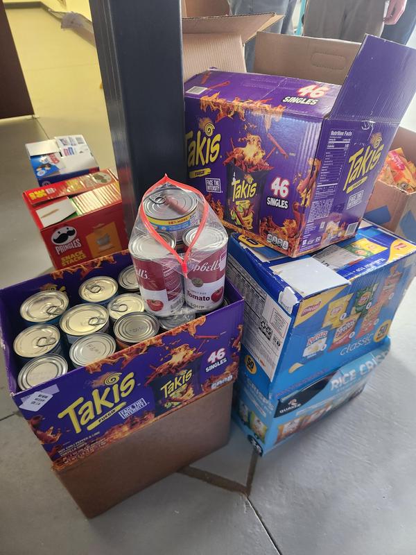 Boxes of canned food that was collected to donate.