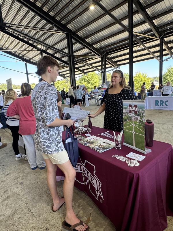 PHS students at the career fair, meeting with different people at tables