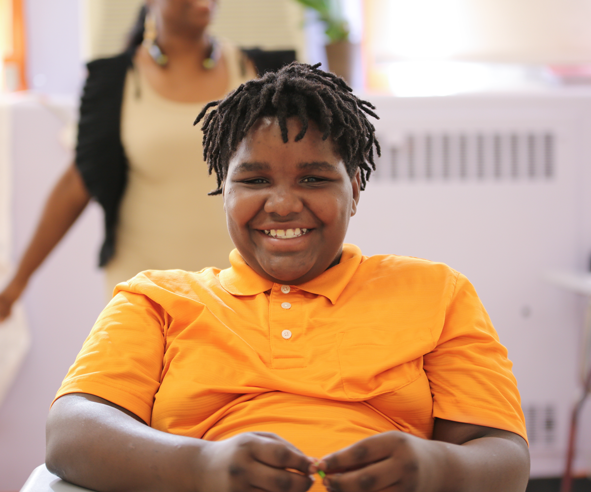 Teacher or school staff member warmly interacting with a student outside
