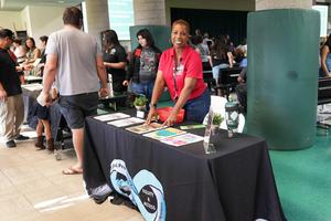 staff member at resource table at Back to School Night