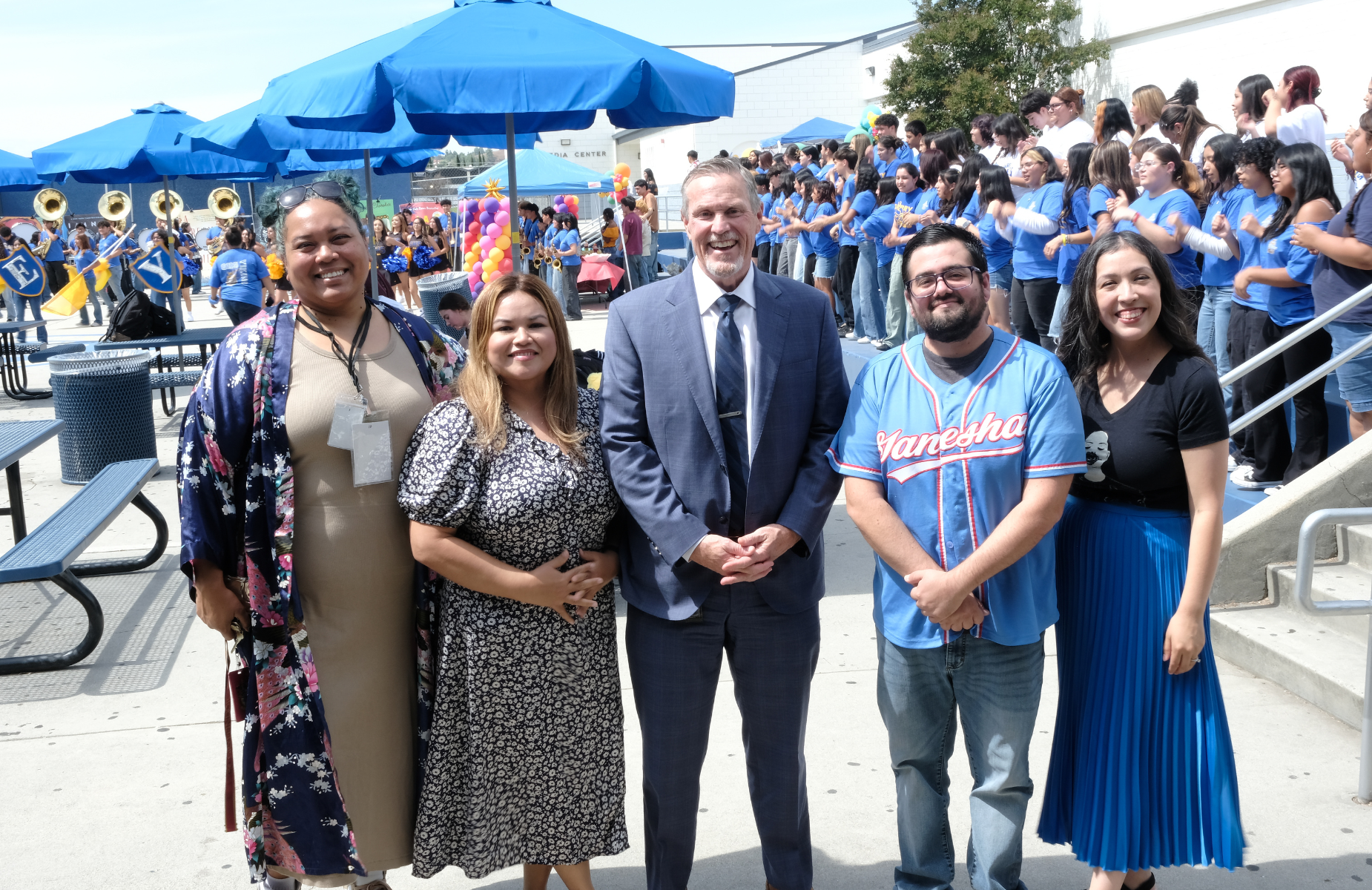 Shuffle banner image of staff and students at Garey HS - Cafe Con Libros event