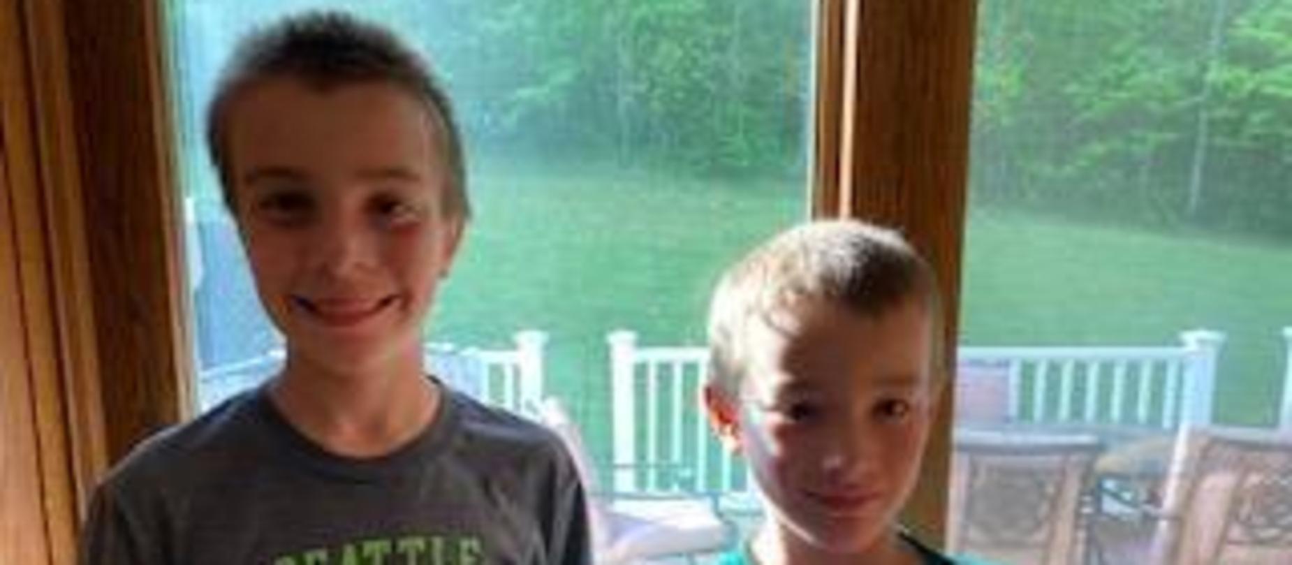 2 boys smiling for the camera
