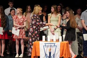 NHS Advisor hands out certificates.