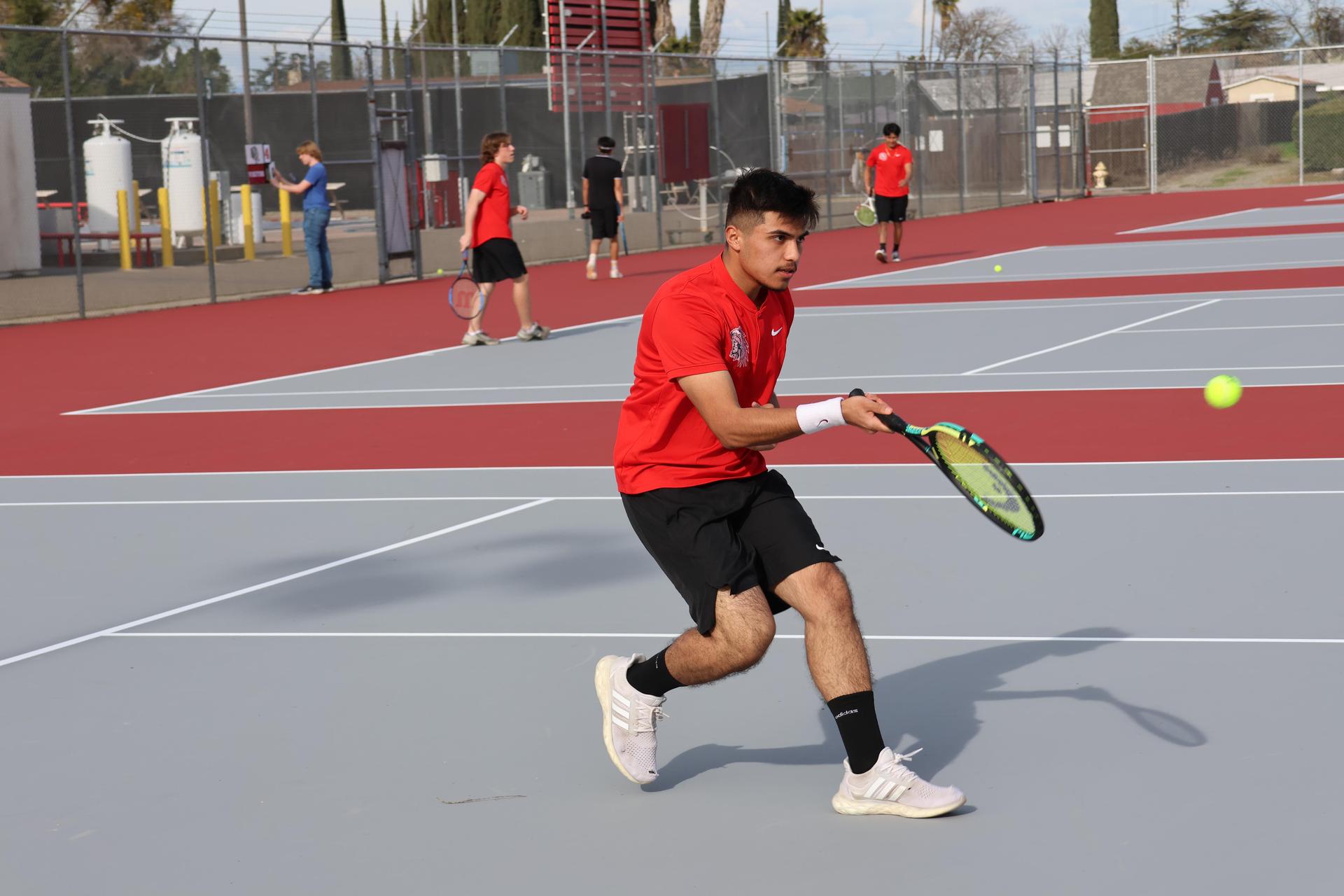 CUHS Boys playing tennis against coalinga
