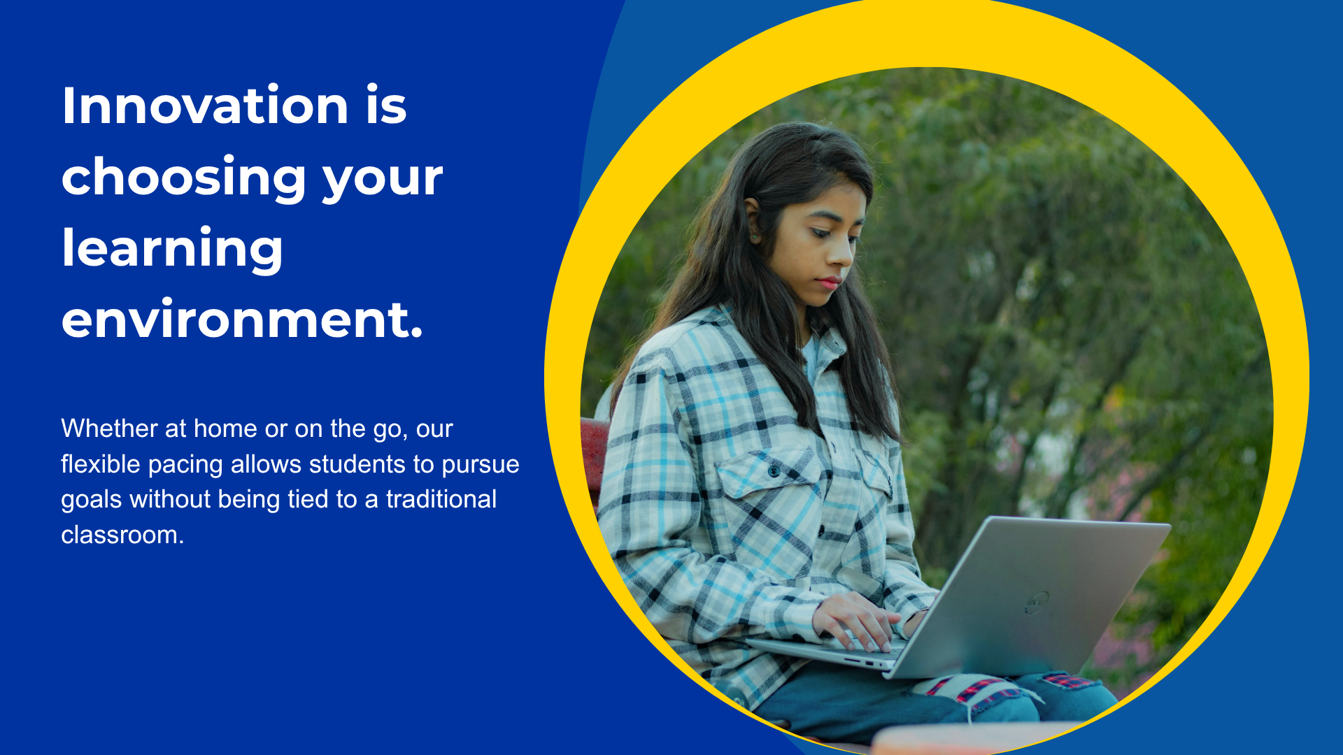 A student studying outdoors on a laptop in a casual environment.