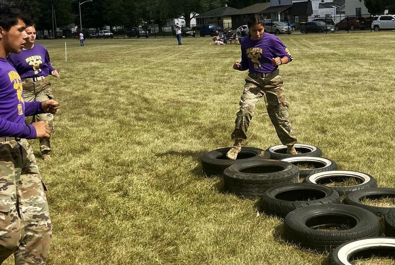 photo: Marion High School JROTC Raider team members cheer on their teammate Cadet Alexa Ortiz, a junior, as she competes in the Ultimate Raider contest at the Huntington North High School Raider competition on Sept. 6, 2025.
