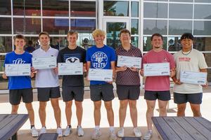 Group of male students pose with their checks