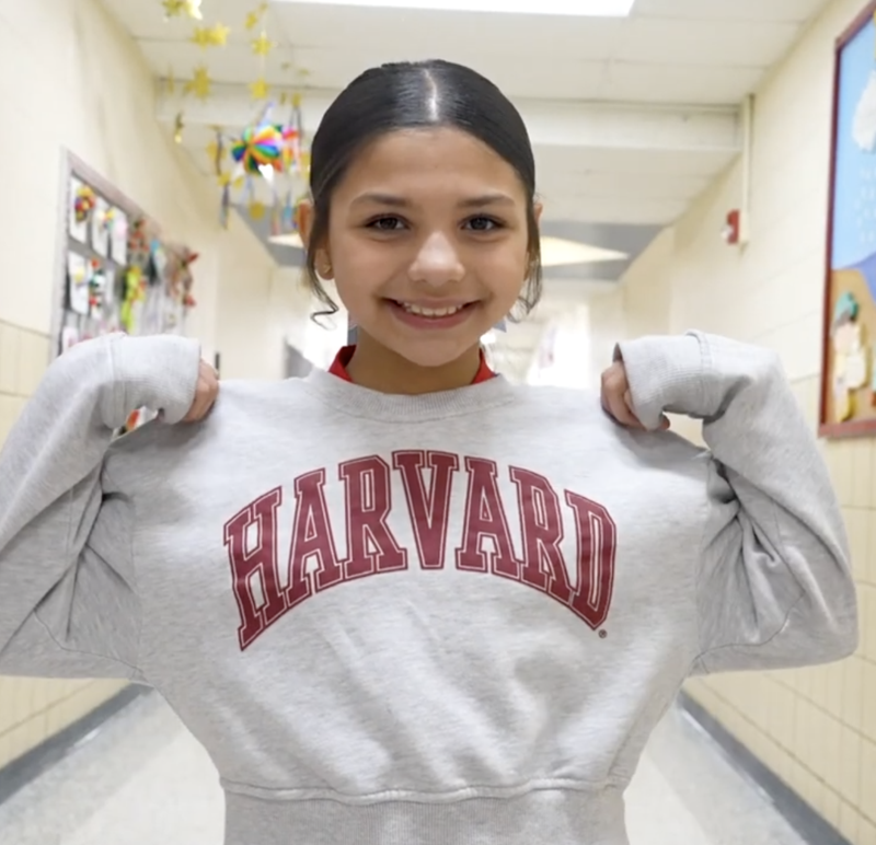 Student in Harvard Sweater