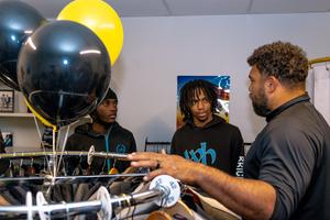 Cam talks with students in Craig's Closet