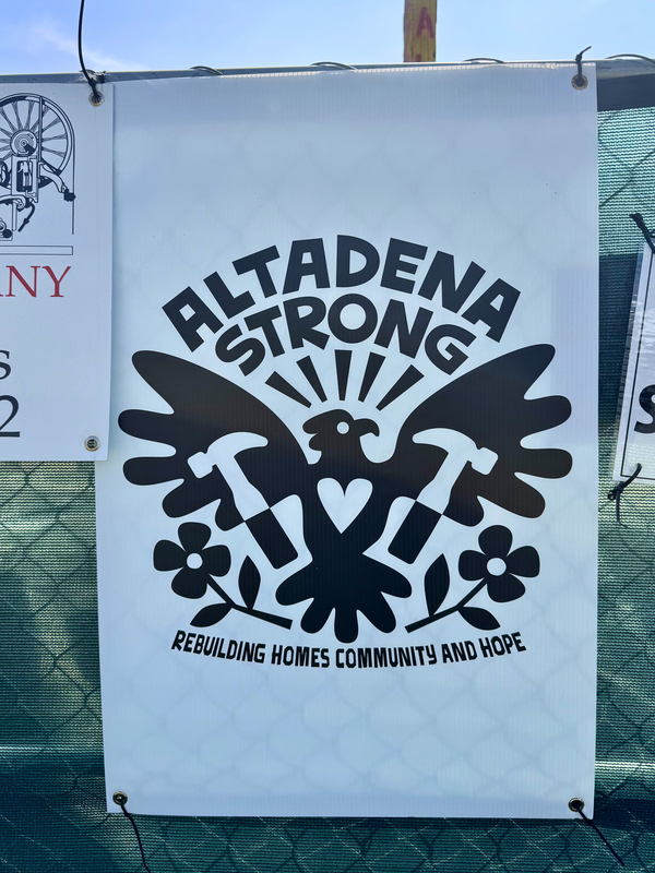 Photo of Altadena Strong poster hung up at the SGV Habitat build site.