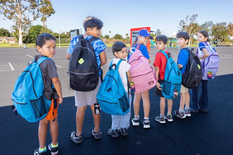 Magnolia Students Displaying their New Backpacks.