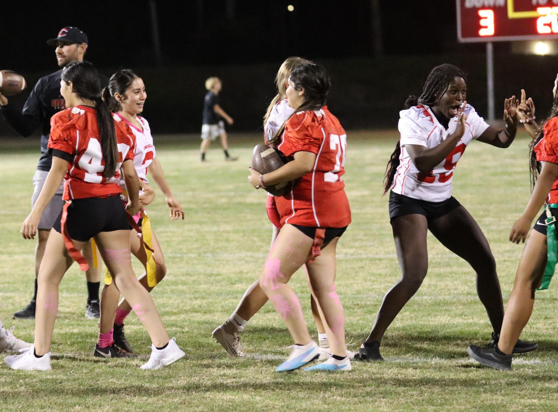students shaking hands after the game