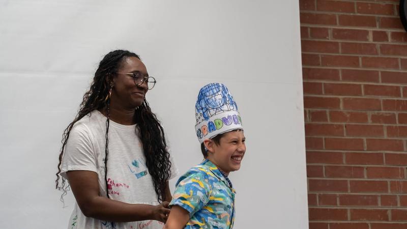 Teacher and student with a crown