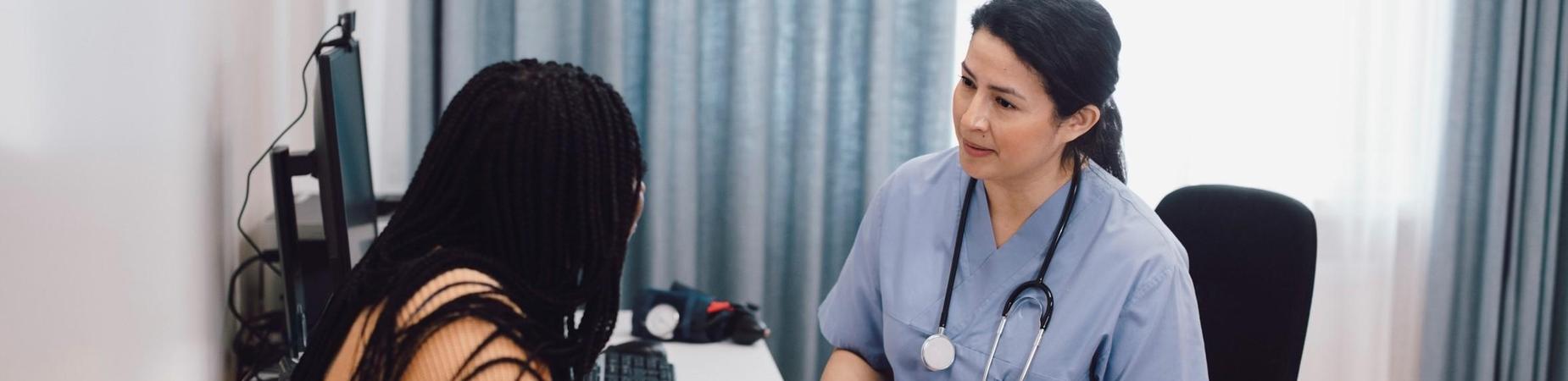 School nurse with student in office
