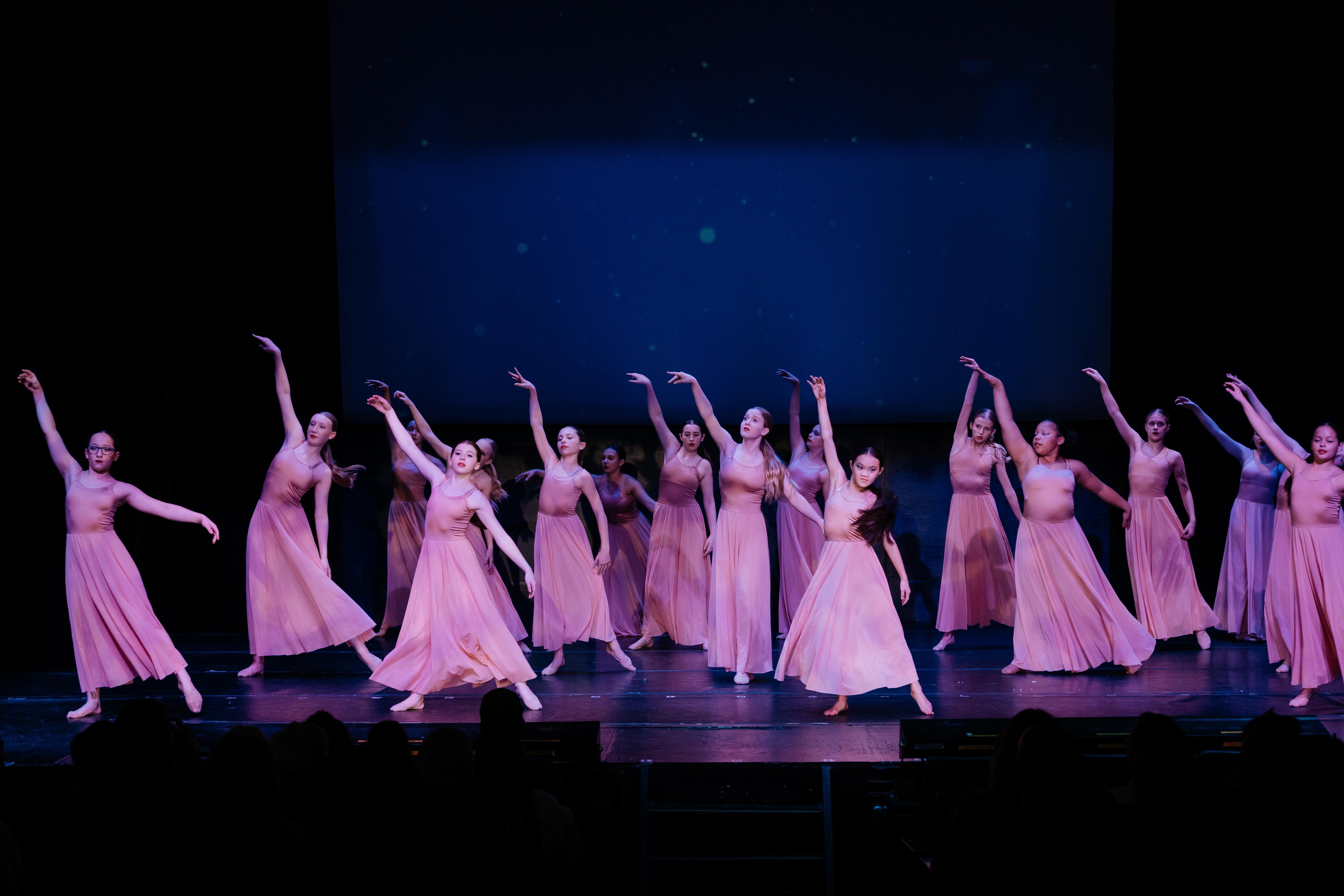 Girls in pink dresses dance Ballet