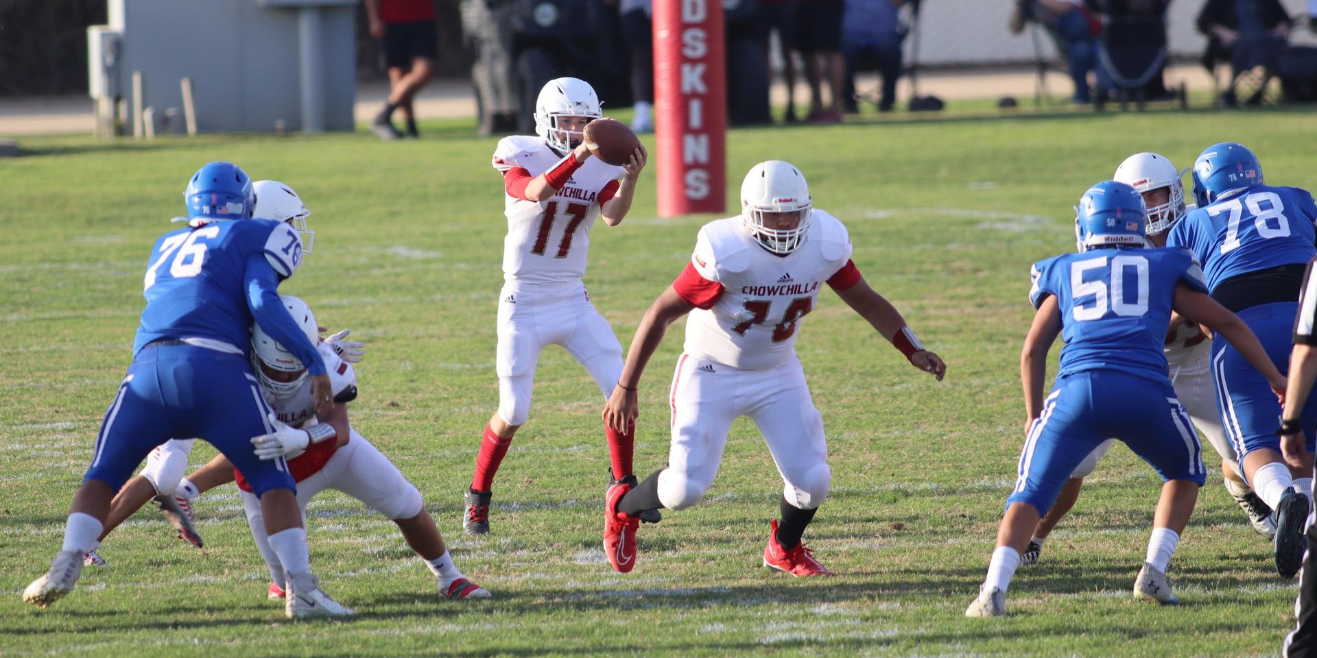 Junior Varsity football players in action against Caruthers