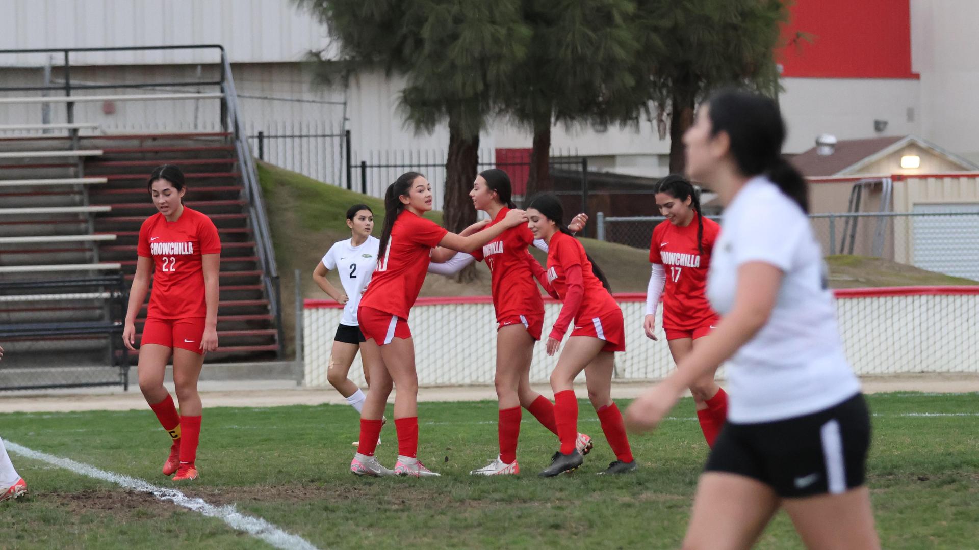 Junior varsity girls playing soccer against liberty