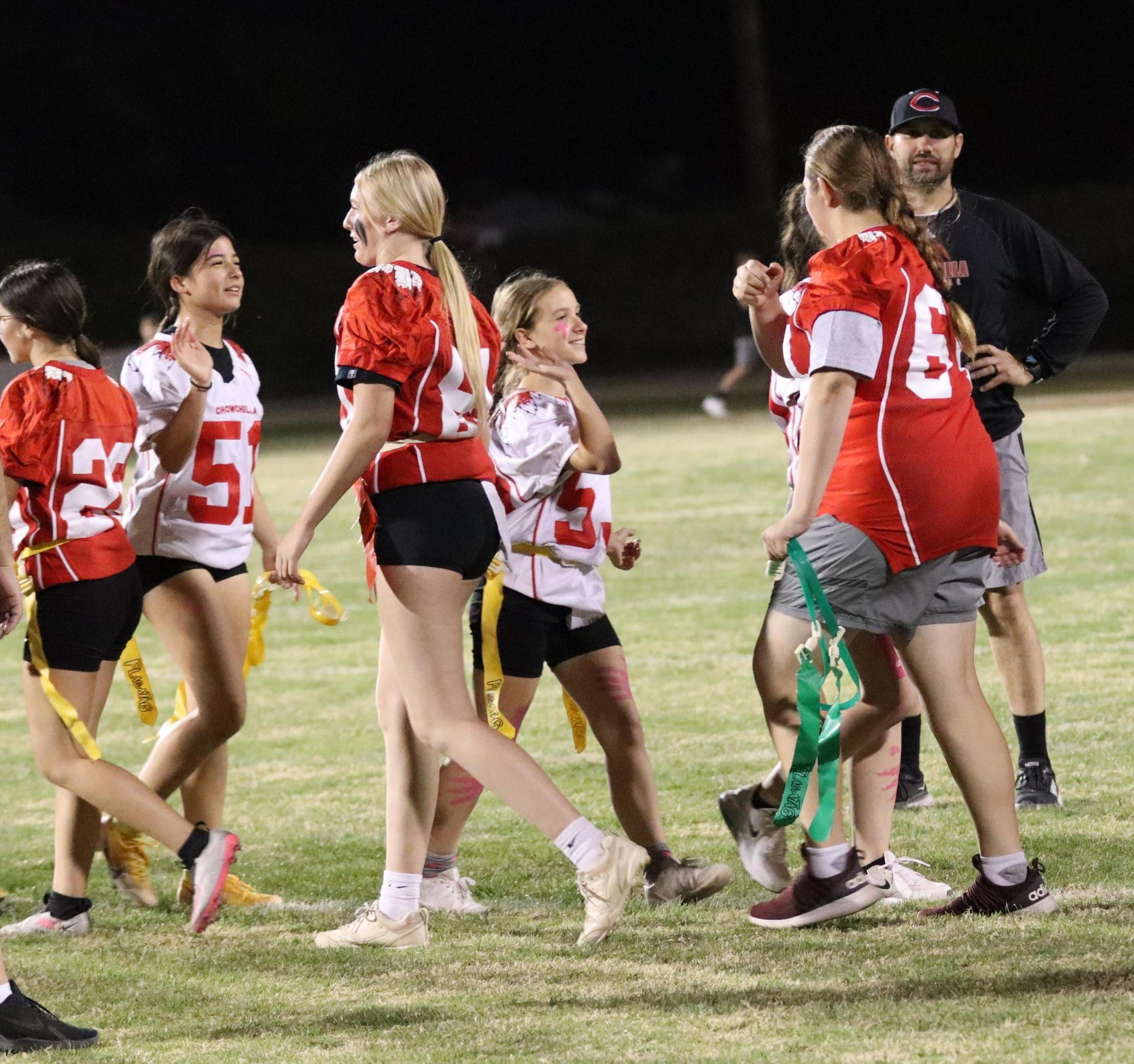 students shaking hands after the game