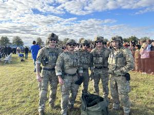 Image of 5 military personnel who descended from a helicopter for all to see