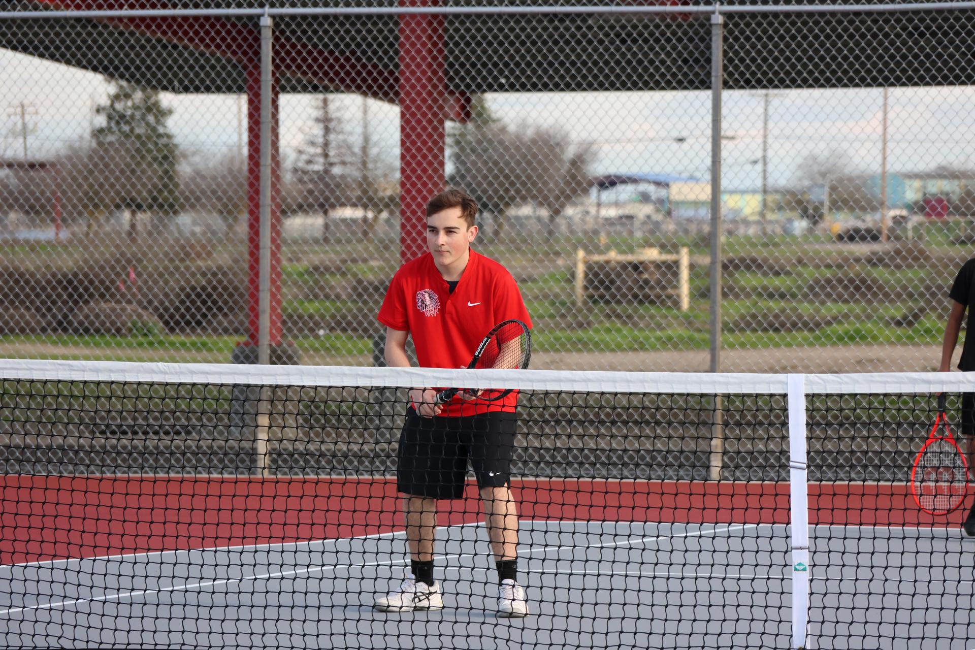 CUHS Boys playing tennis against coalinga