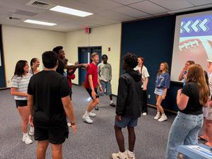 Students working together during Big Cat Council meeting