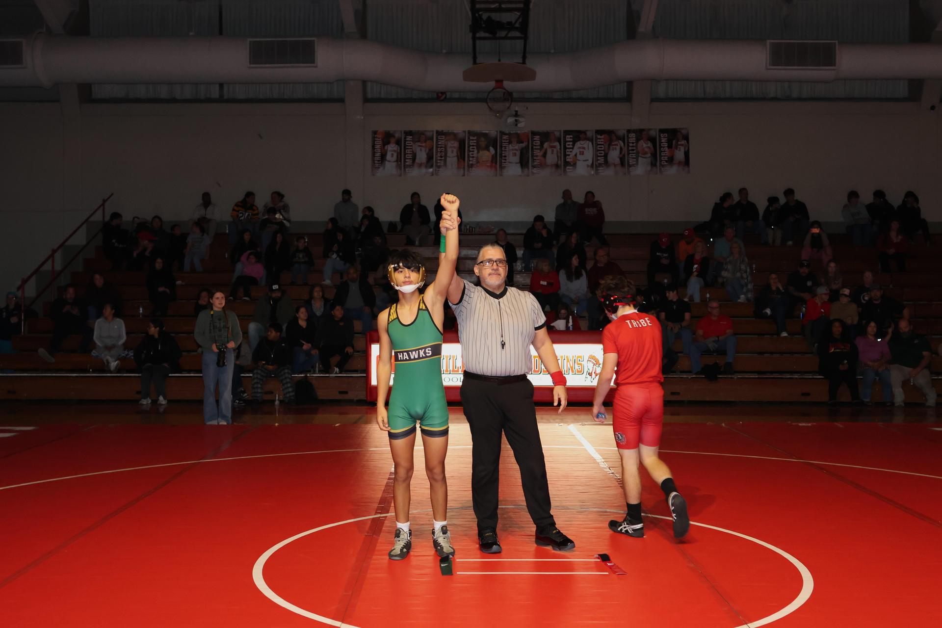 Wrestling winners with hands up 83