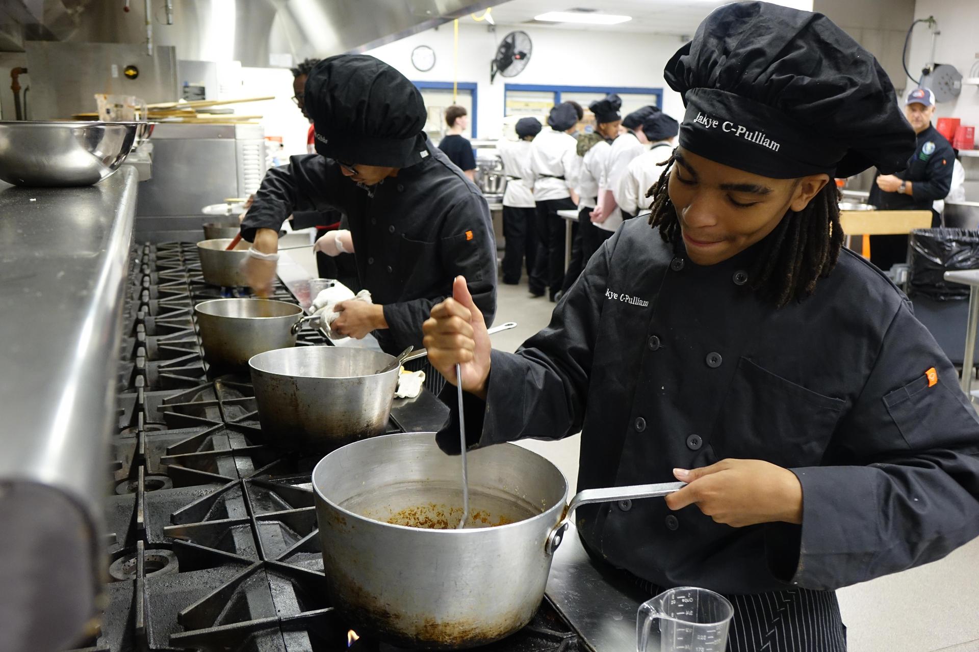 culinary student at the oven