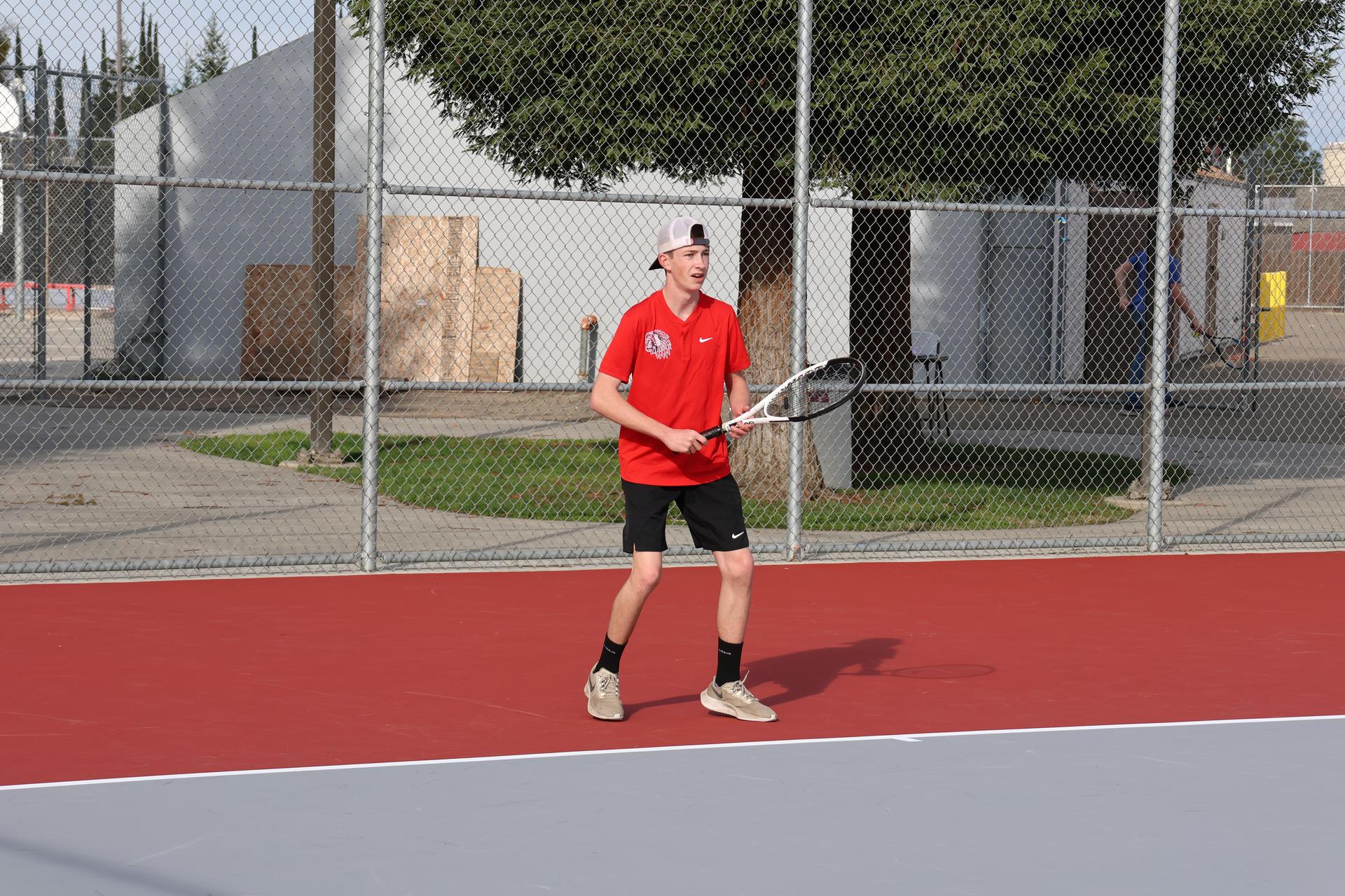 CUHS Boys playing tennis against coalinga