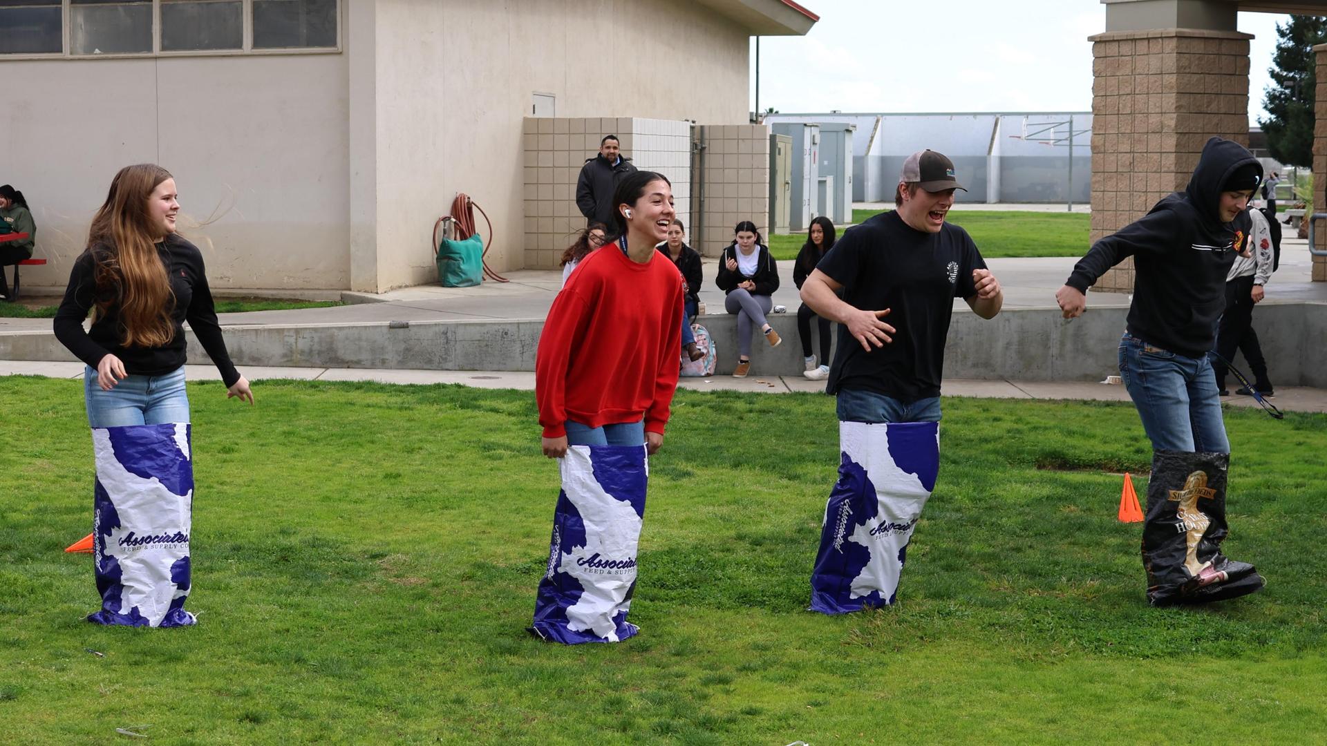 students and staff enjoying the feed bag relay