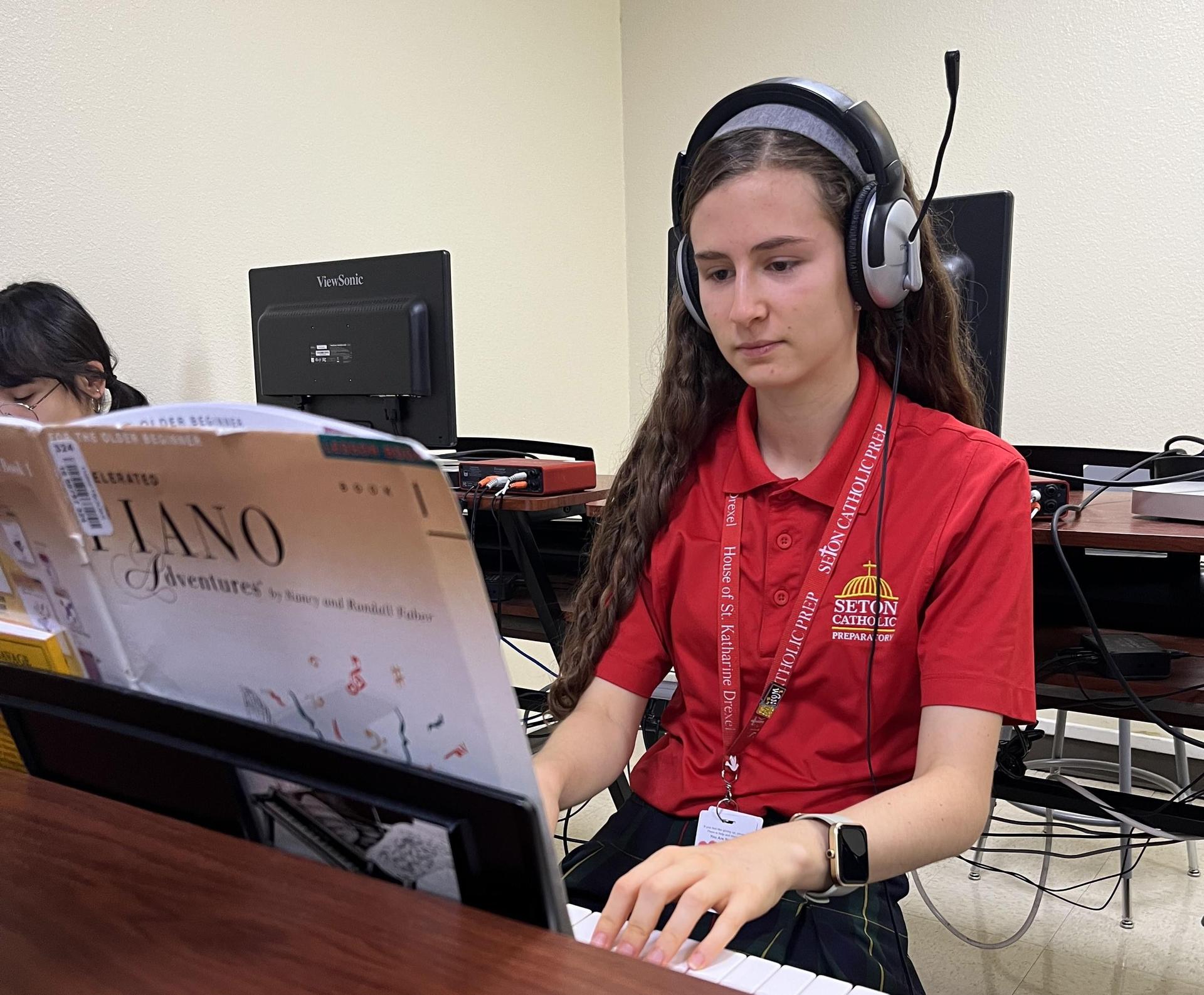 Student in piano class