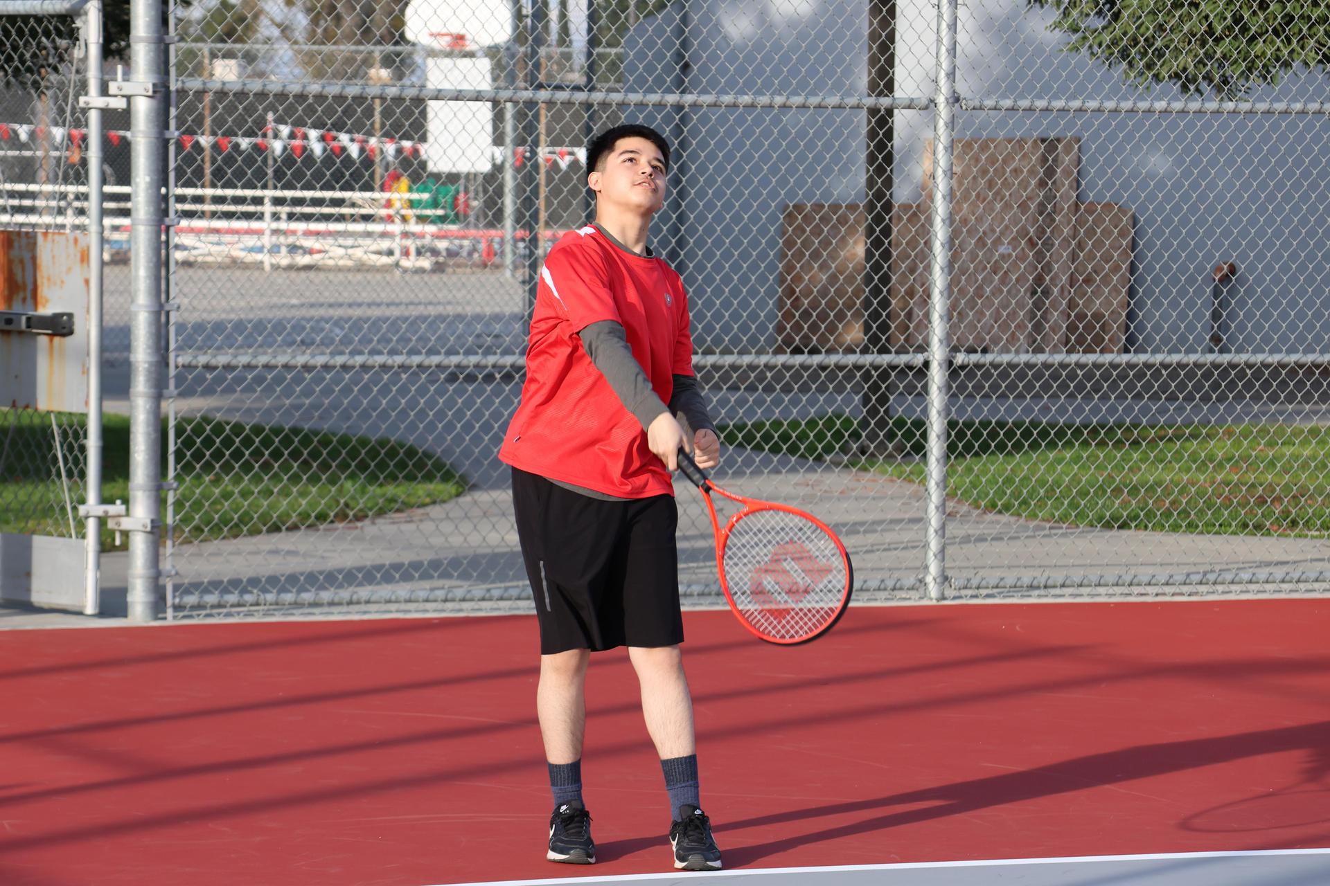 CUHS Boys playing tennis against coalinga