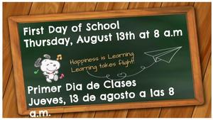 Chalkboard announcement for first day of school in English and Spanish.