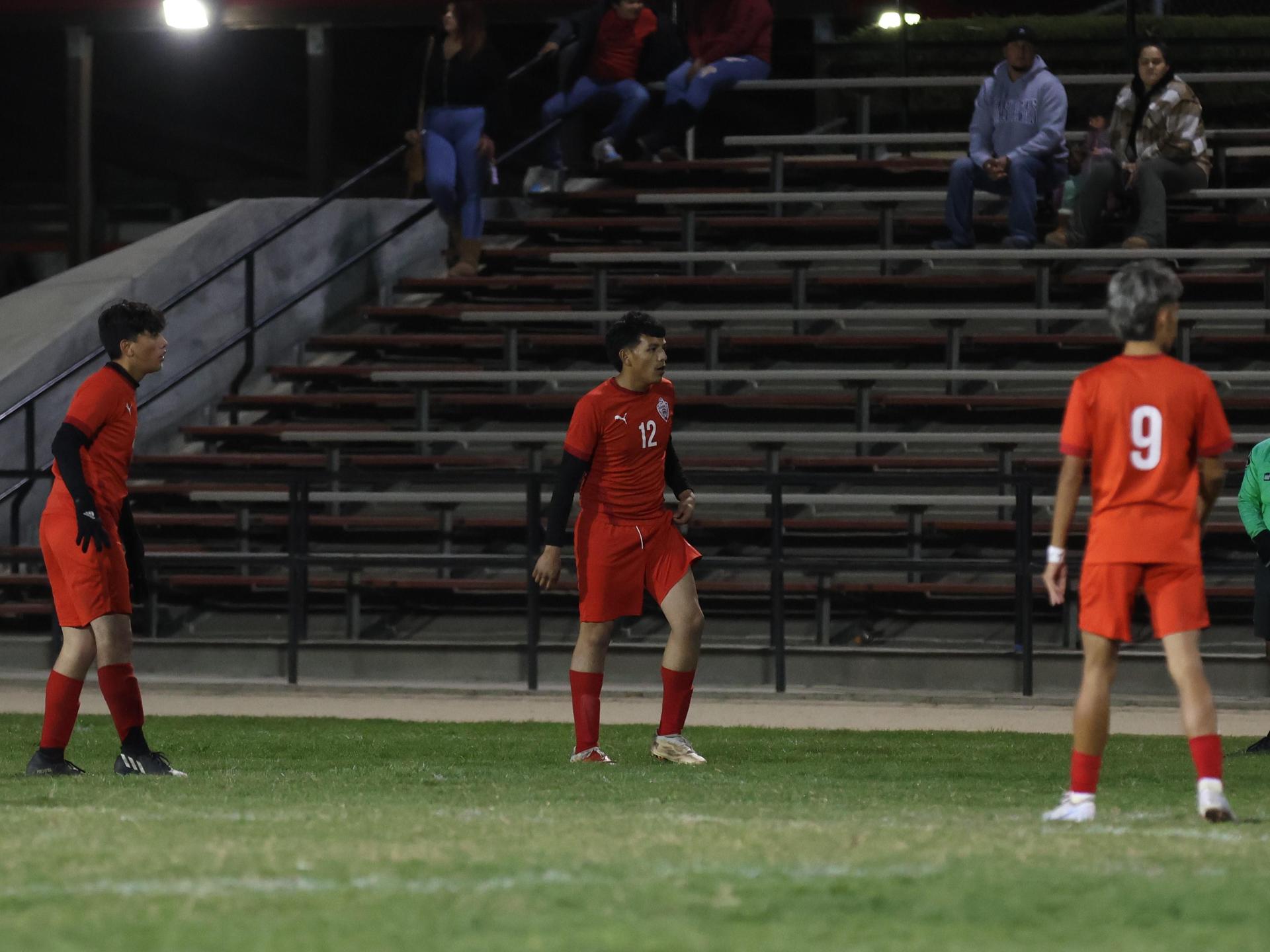 Varsity boys play soccer against Kingsburg