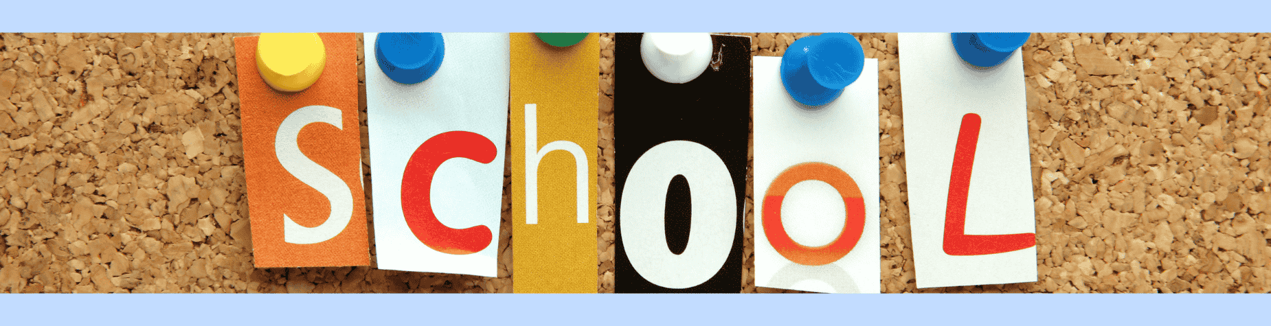 Colorful letters spelling 'school' on a corkboard.