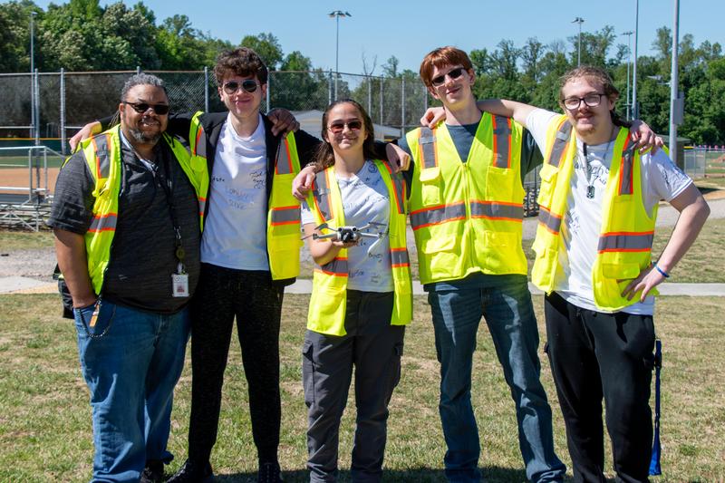 Alondra Aponte, Landyn Davis, Jacob Germanos, and Nathaniel Hott are joined by their teacher Mr. Burch Surgeon.