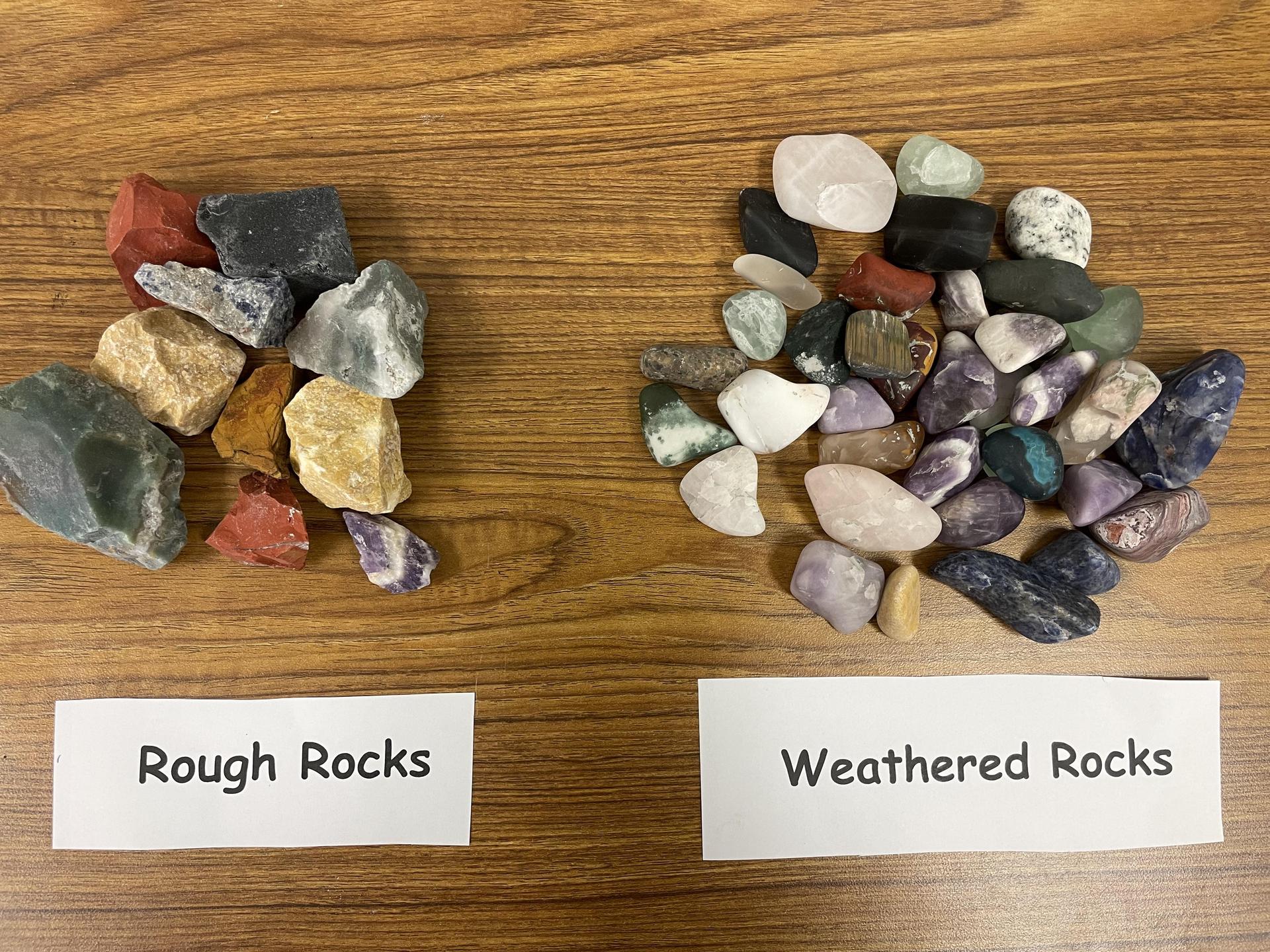 Two groupings of rocks labeled 'Rough Rocks' and 'Weathered Rocks' on a table.
