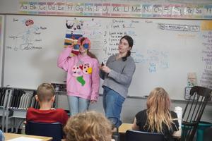 Two TATU students show how the body is damaged by tobacco.