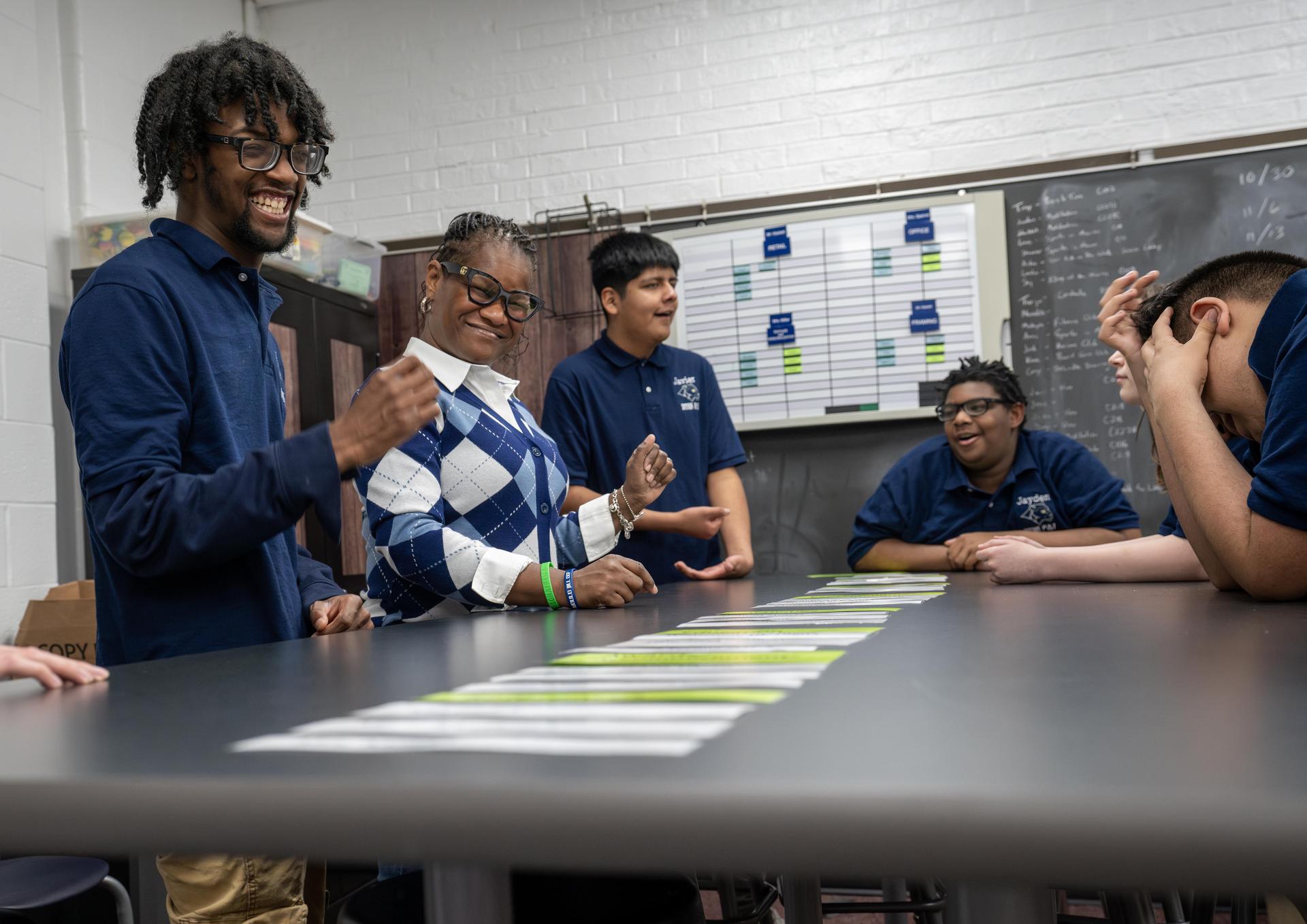 teacher and students working together