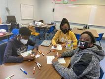 Students working on Christmas door decorations
