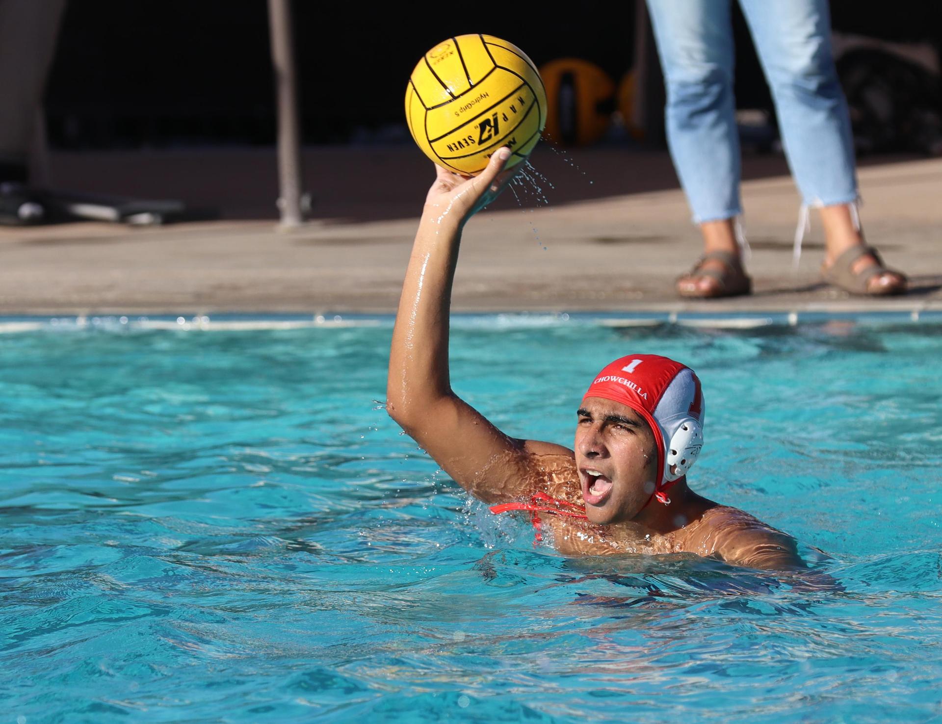 boys water polo players in action against san joaquin memorial